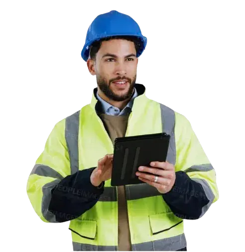 Construction worker in a hard hat using a tablet
