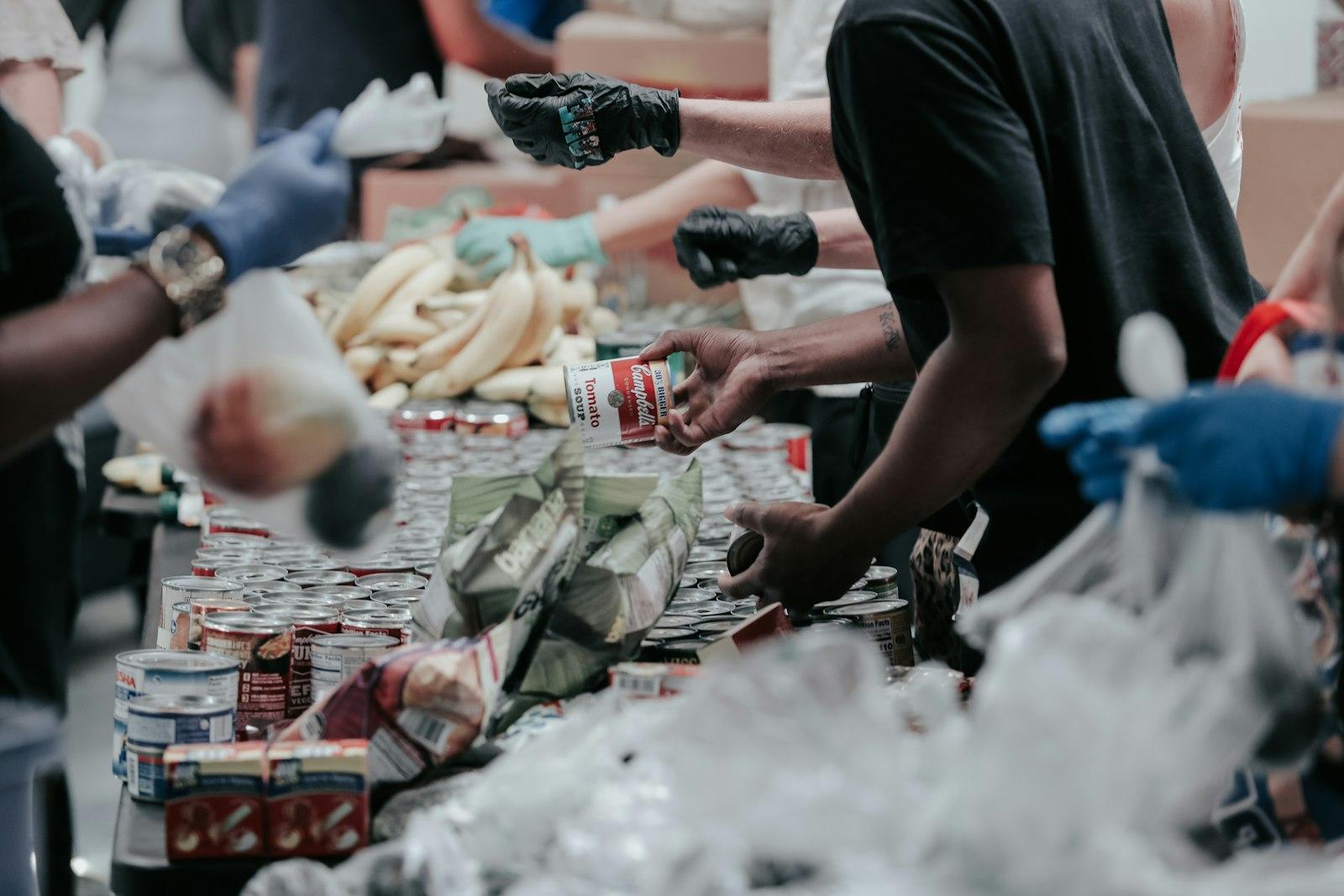 Volunteers sorting food donations at a community food bank
